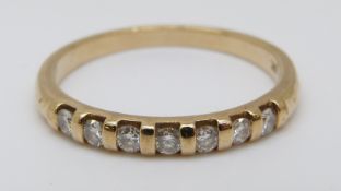A 9ct gold half eternity ring set with diamonds, 1.