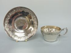 A French white metal cup and saucer, Paris maker Henri Soufflot (1884-1910),