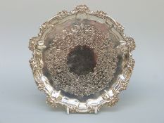 A Georgian hallmarked silver three footed salver with rim and engraved decoration, London 1804,