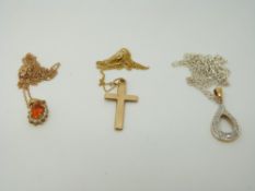 A 9ct gold cross pendant, a 9ct gold pendant set with a citrine and diamonds,