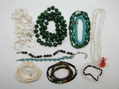 A garnet and pearl bracelet, a rock crystal necklace, two pearl necklaces, tiger's eye bracelet,