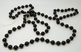 A beaded black onyx necklace and bracelet with 14ct gold beads