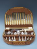 A light oak cased 45-piece bone-handled cutlery set by Winegartens Ltd, 145 Bishopsgate,