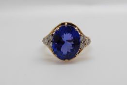 An 18ct gold ring set with an oval tanzanite of approximately 5.