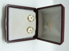 A pair of 9ct gold earrings set with white and green enamel in the form of flowers, 3.