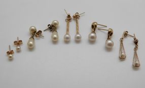 Four 9ct gold and pearl earnings