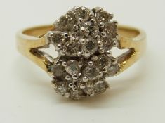 A 14ct gold ring set with diamonds in a cluster, 3.