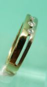 A 9ct gold bi-coloured ring set with three diamonds, 2.