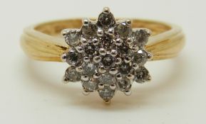 An 18ct gold ring set with diamonds in a cluster, total diamond weight approximately 0.5ct, 3.