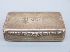 A George V hallmarked silver Georgian style snuff box with engine turned decoration,