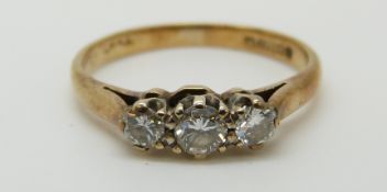 An 18ct gold ring set with three diamonds, total diamond weight approximately 0.35ct, 1.