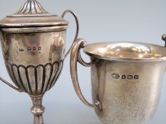 A small hallmarked silver lidded trophy cup, height 10.