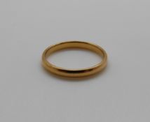 A 22ct gold wedding band, 2.