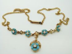An Edwardian 18ct gold necklace set with seed pearls, blue enamel flowers and an old cut diamond, 9.