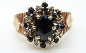 A 9ct gold ring set with sapphires and diamonds (size K)