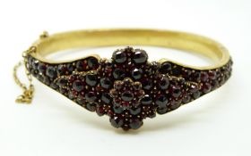 A Victorian bangle set with Bohemian garnets