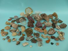A box of geological specimens to include amethyst, tourmaline, hematite, garnet,