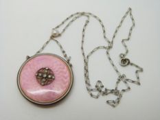 A Victorian pendant set with pink guilloche enamel,