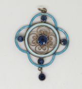 A silver pendant with blue enamel decoration set with blue stones,