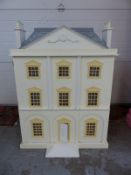 A large fully furnished Georgian style dolls house with removable roof,