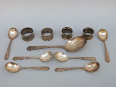 Four various hallmarked silver napkin rings,