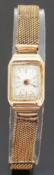 9ct gold ladies wristwatch with Arabic numerals and gold hands, on mesh bracelet, case size 14x22mm,