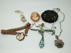 A carved jet brooch, 9ct gold pendant set with a cameo,