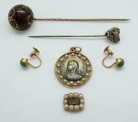 A pair of 9ct gold earrings set with a turquoise cabochon to each,