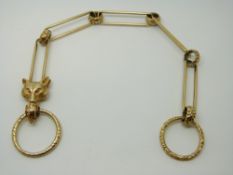 A Victorian fob chain made up of elongated links, engraved circular links and a fox's head, 37.