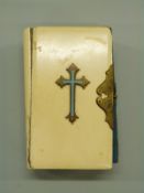 Ivory bound Book of Common Prayer with enamelled cross and brass clasp