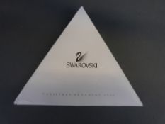 A collection of seven Swarovski Christmas tree ornaments comprising 1998 through to 2003 together