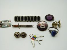 A Charles Horner silver brooch in the form of a buckle set with enamel,