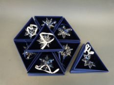 A collection of eight Swarovski Christmas tree ornaments comprising 2006 through to 2013,
