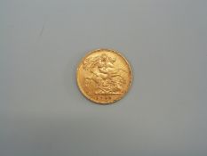 A 1909 gold half sovereign.
