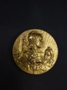 A yellow metal French Colonial medal 