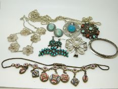 A silver rope twist chain, a silver filigree necklace, a silver filigree brooch,