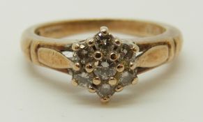 A 9ct gold ring set with diamonds in a cluster, total diamond weight approximately 0.33ct, 3.