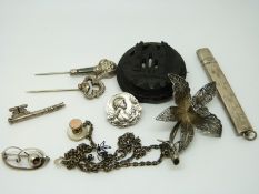 A hallmarked silver pencil holder, a French silver Art Nouveau brooch depicting a woman signed E.