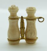 A bone Stanhope in the form of a pair of binoculars, 2.