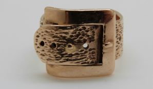 A 14ct gold buckle ring, 4.