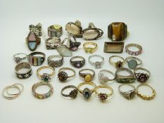Thirty silver rings including examples set with abalone, garnet, amethysts, mother of pearl,