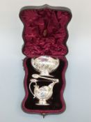 A Victorian cased hallmarked silver pedestal milk jug,