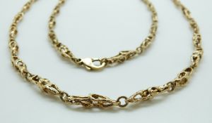 A 9ct gold necklace made up of cage links, 72cm, 34.