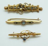 Three 9ct gold brooches including one set with an aquamarine,