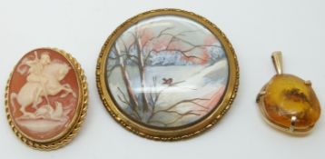 A 9ct gold brooch set with a cameo, a painted brooch and an amber set pendant.