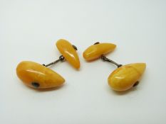 A pair of silver cufflinks each set with two amber cabochons approximately 25x10mm, 6g.