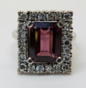 An 18ct gold ring set with a topaz and diamonds (size K)