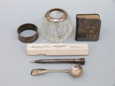 A hallmarked silver mounted cut and lobed glass match striker, silver mounted miniature bible,