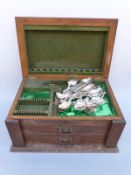 A George V part 12 place setting oak cased canteen of Old English pattern hallmarked silver cutlery