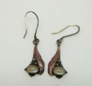A pair of silver Arts & Crafts earrings each set with a moonstone